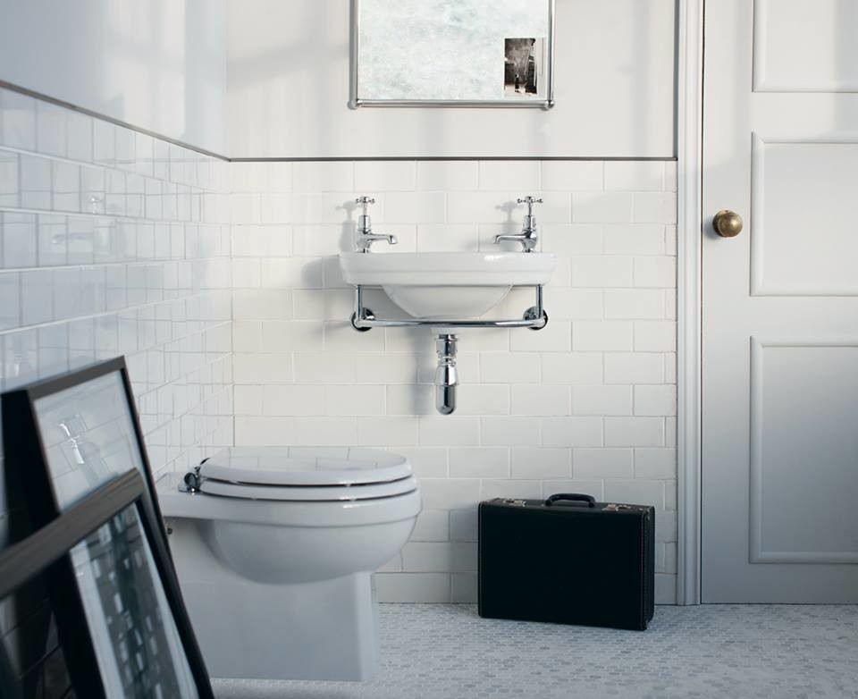 Medium sized traditional family bathroom in Cambridgeshire with shaker cabinets, medium wood cabinets, a claw-foot bath, a built-in shower, a one-piece toilet, white tiles, ceramic tiles, white walls, porcelain flooring, a pedestal sink and marble worktops.