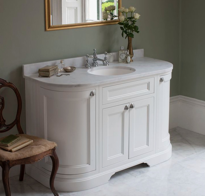 Medium sized traditional family bathroom in Cambridgeshire with shaker cabinets, medium wood cabinets, a claw-foot bath, a built-in shower, a one-piece toilet, white tiles, ceramic tiles, white walls, porcelain flooring, a pedestal sink and marble worktops.