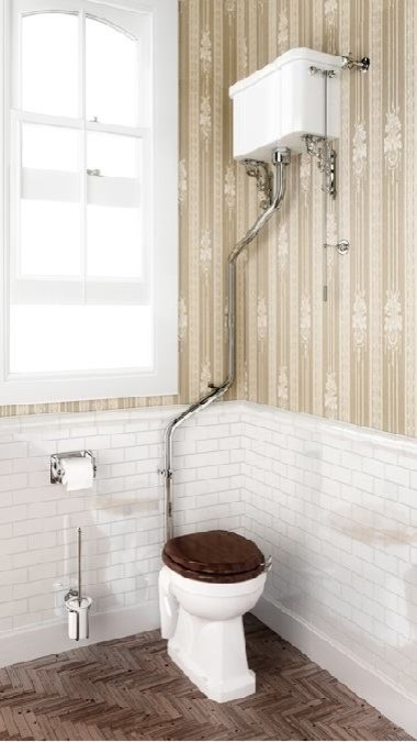 Bathroom - mid-sized traditional kids' white tile and ceramic tile porcelain tile bathroom idea in Cambridgeshire with shaker cabinets, medium tone wood cabinets, a one-piece toilet, white walls, a pedestal sink and marble countertops