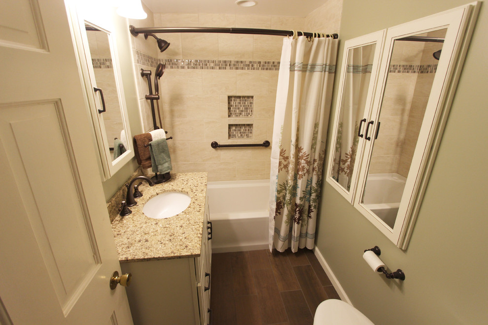 Inspiration for a small timeless master ceramic tile bathroom remodel in Cleveland with white cabinets, a two-piece toilet, green walls, an undermount sink and granite countertops
