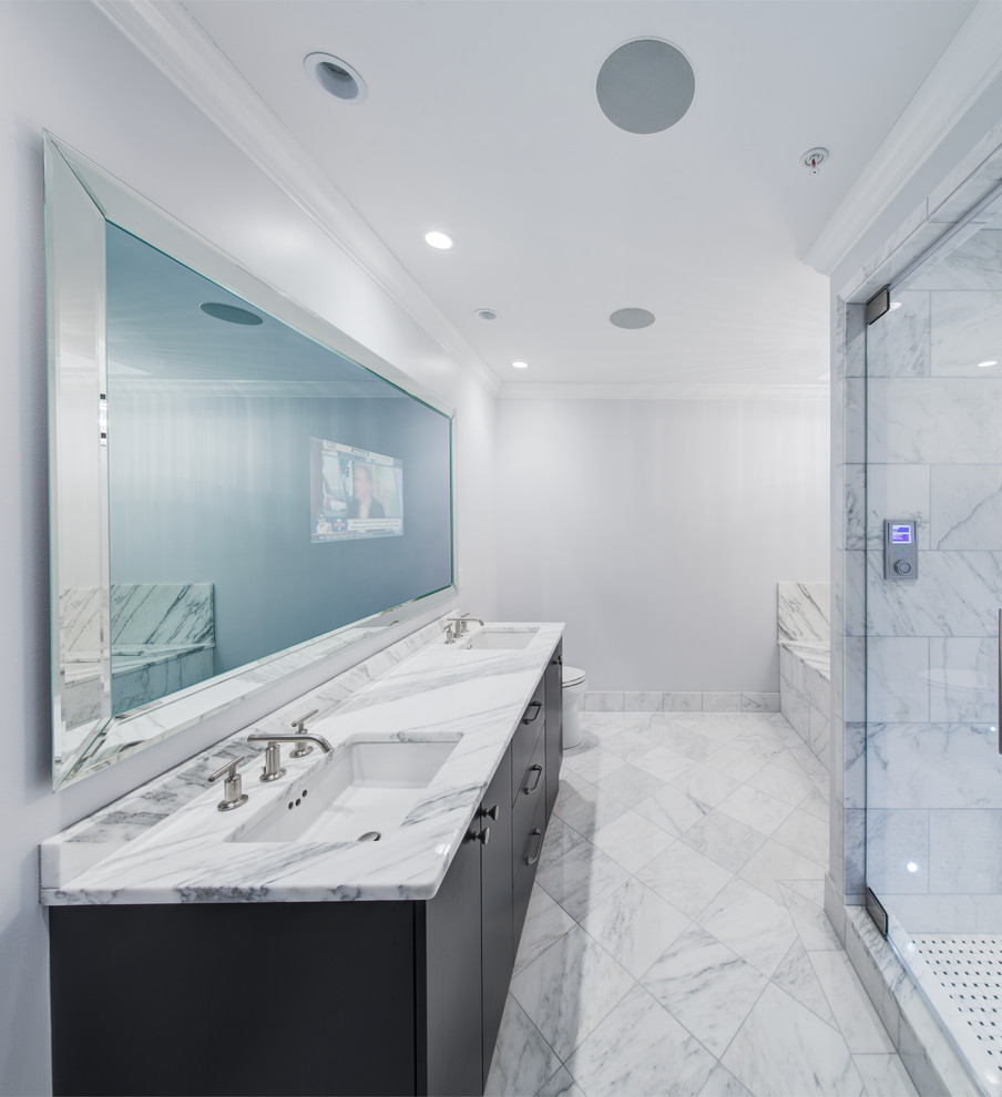 Large transitional white tile and stone tile marble floor sauna photo in Chicago with an undermount sink, flat-panel cabinets, dark wood cabinets, marble countertops, an undermount tub, a one-piece toilet and white walls