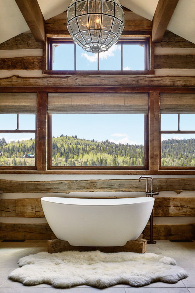 Inspiration for a rustic ensuite bathroom in Other with a freestanding bath.