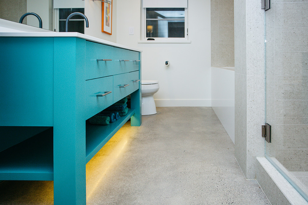 Inspiration for a mid-sized modern 3/4 concrete floor, gray floor and single-sink bathroom remodel in Portland with shaker cabinets, blue cabinets, white walls, an undermount sink, a hinged shower door, white countertops and a built-in vanity