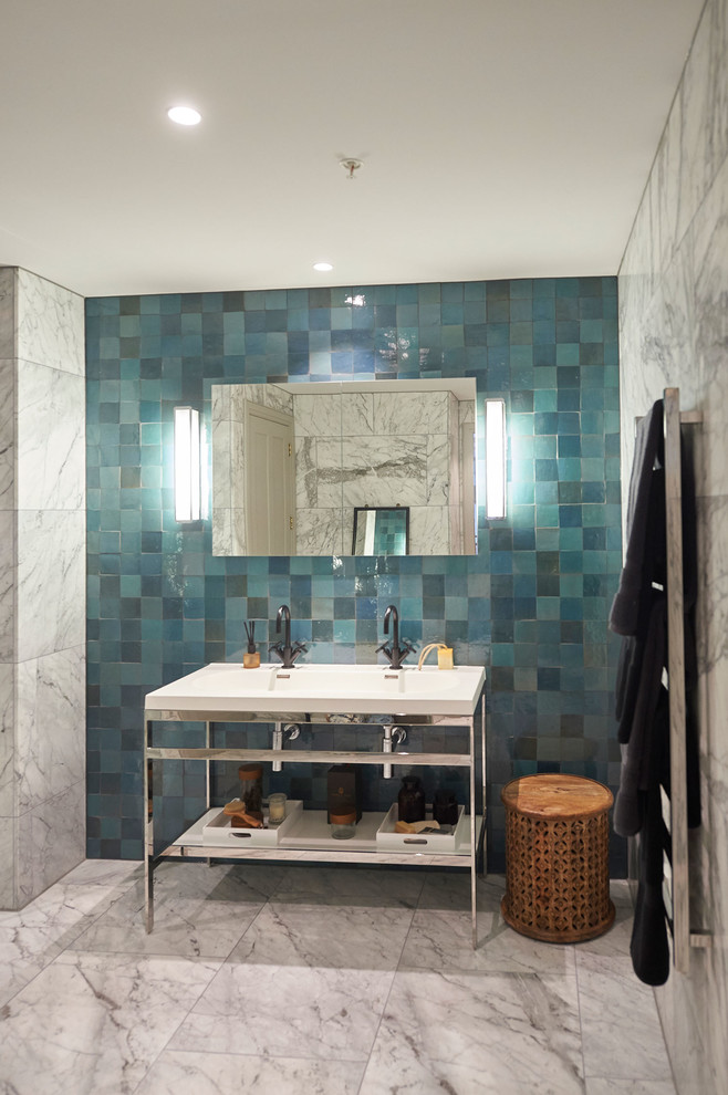 Inspiration for a large contemporary shower room bathroom in London with a built-in shower and blue tiles.