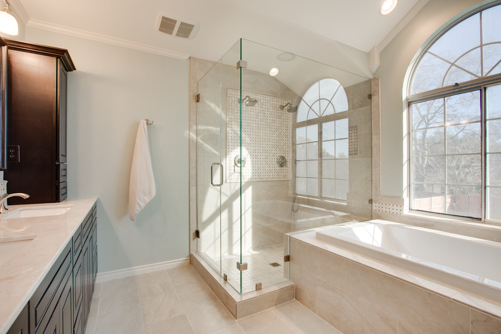 Medium sized classic ensuite bathroom in Dallas with shaker cabinets, dark wood cabinets, a built-in bath, a double shower, a two-piece toilet, white tiles, mosaic tiles, blue walls, porcelain flooring, a submerged sink and marble worktops.