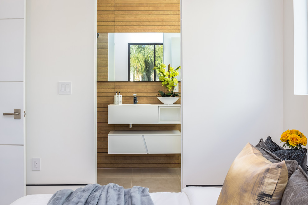 Inspiration for a contemporary bathroom remodel in Los Angeles with flat-panel cabinets, white cabinets and brown walls