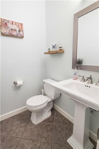 Small eclectic porcelain tile bathroom photo in Austin with a pedestal sink and blue walls