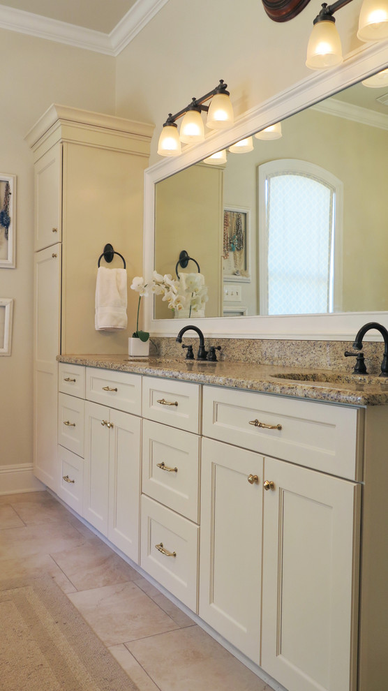 Example of a mid-sized classic master beige tile travertine floor bathroom design in New Orleans with a wall-mount sink, flat-panel cabinets, white cabinets, granite countertops and beige walls