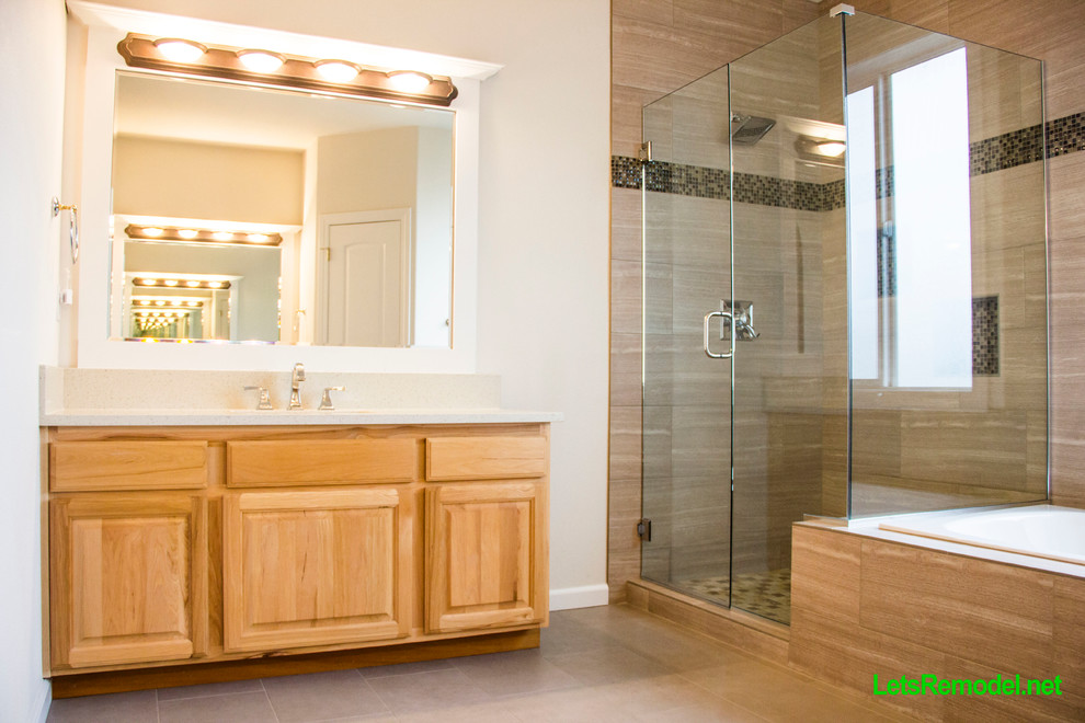 Inspiration for a mid-sized eclectic master beige tile and porcelain tile porcelain tile bathroom remodel in Portland with an undermount sink, raised-panel cabinets, light wood cabinets, quartz countertops, a two-piece toilet and beige walls