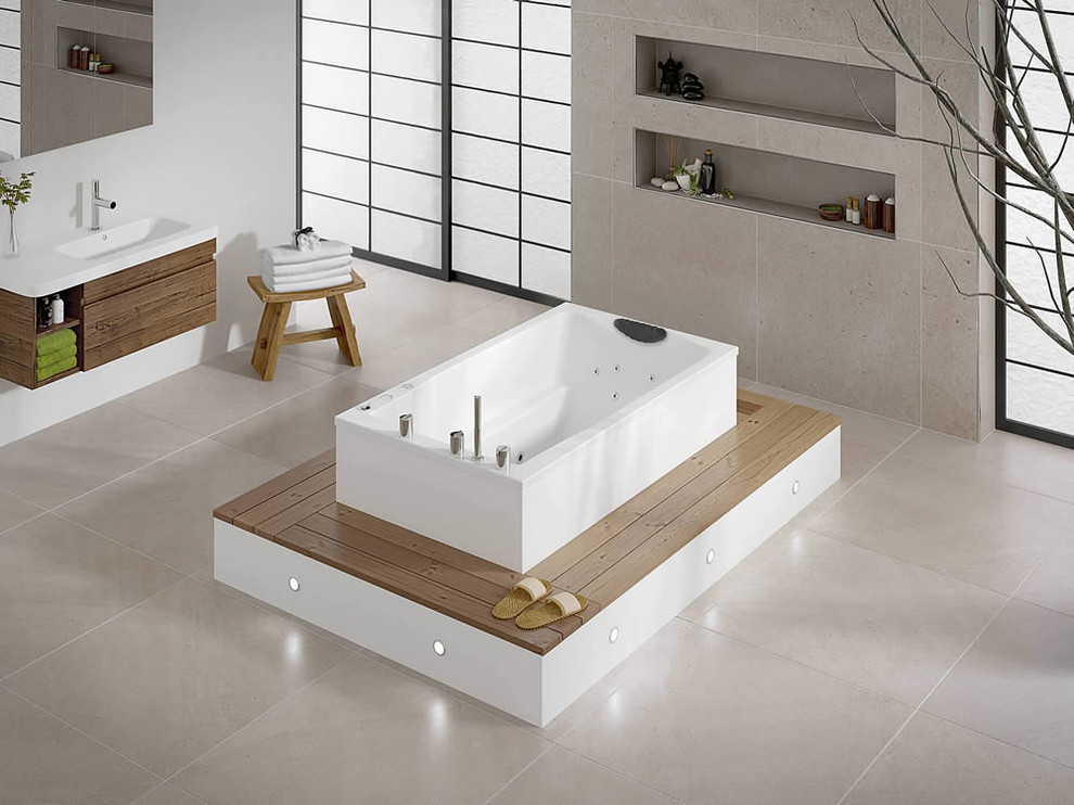 Immagine di una grande stanza da bagno etnica con vasca giapponese, piastrelle beige, piastrelle di cemento, pareti nere, pavimento con piastrelle in ceramica e lavabo sospeso