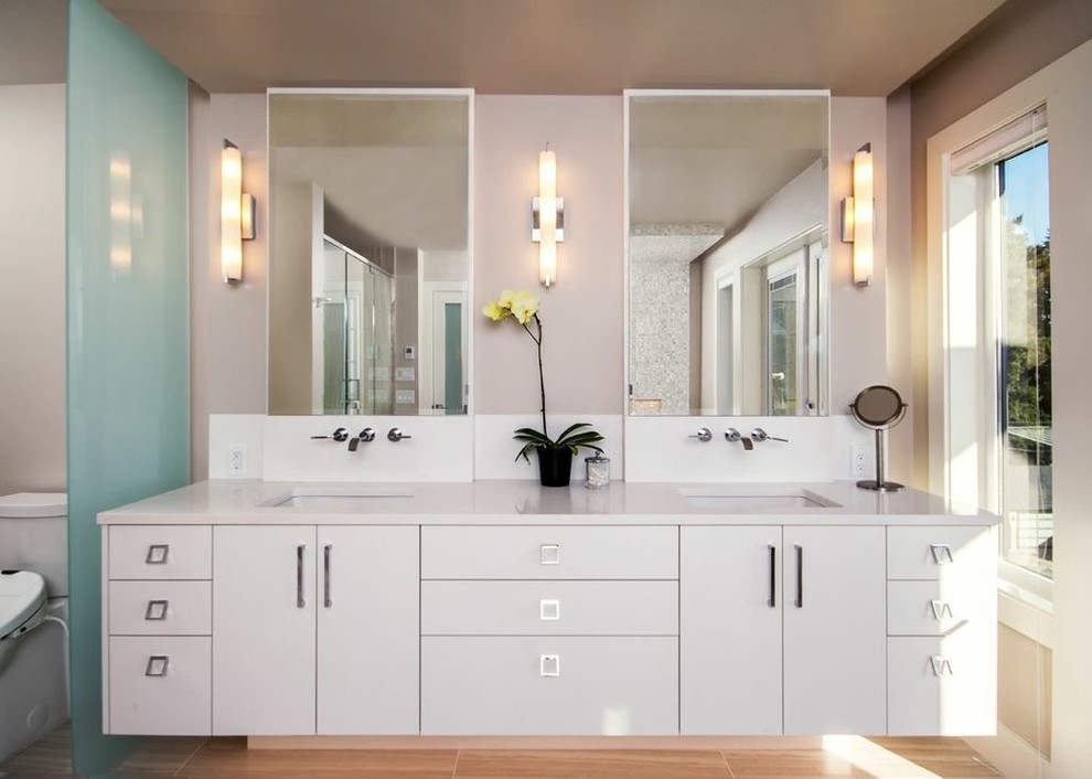 Inspiration for a contemporary beige tile and ceramic tile bathroom remodel in Vancouver with an undermount sink, flat-panel cabinets, white cabinets and quartz countertops