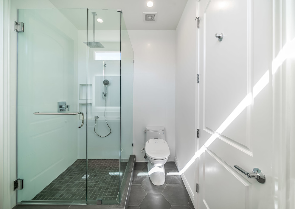 Medium sized scandinavian ensuite bathroom in Los Angeles with recessed-panel cabinets, white cabinets, an alcove bath, a corner shower, a one-piece toilet, white tiles, ceramic tiles, white walls, marble flooring, a submerged sink, engineered stone worktops, multi-coloured floors, a sliding door and grey worktops.