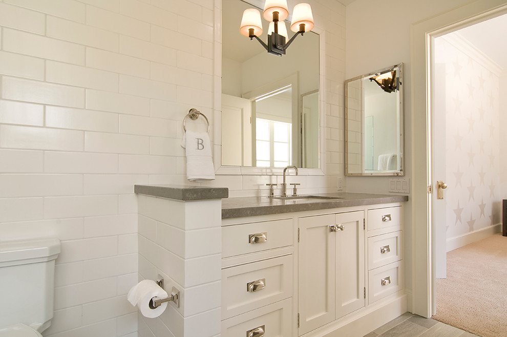 Medium sized classic family bathroom in Los Angeles with beaded cabinets, white cabinets, white tiles, metro tiles, white walls, a submerged sink, limestone worktops, beige floors and grey worktops.