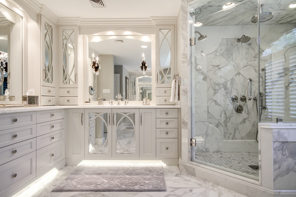 Inspiration for a large traditional ensuite bathroom in Philadelphia with a submerged sink, recessed-panel cabinets, white cabinets, marble worktops, a corner shower, white tiles, stone tiles, grey walls and marble flooring.