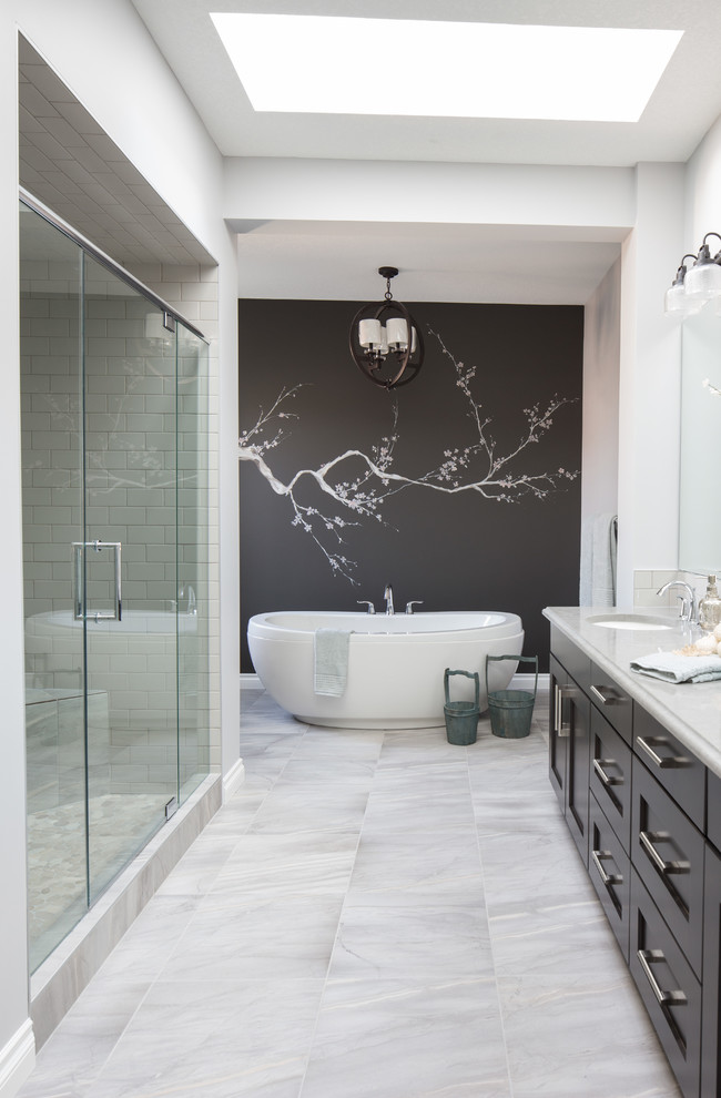 Inspiration for a large transitional master white tile and porcelain tile porcelain tile bathroom remodel in Calgary with an undermount sink, shaker cabinets, dark wood cabinets, quartzite countertops and gray walls