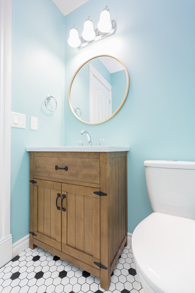Example of a large transitional 3/4 mosaic tile floor and multicolored floor bathroom design in Calgary with flat-panel cabinets, dark wood cabinets, a two-piece toilet and blue walls