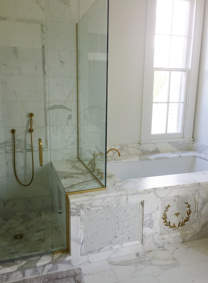 Large elegant master white tile and marble tile marble floor and white floor tub/shower combo photo in New Orleans with an undermount tub, white walls and a hinged shower door