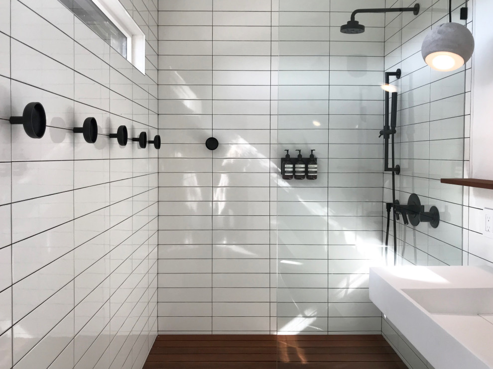 Example of a trendy master white tile and porcelain tile marble floor, white floor and double-sink bathroom design in New York with a one-piece toilet, white walls, an undermount sink, quartz countertops, gray countertops and a floating vanity