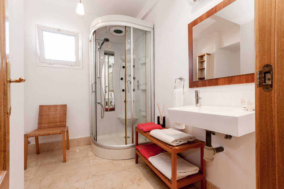 Photo of a medium sized contemporary shower room bathroom in Malaga with a corner shower, white walls and a wall-mounted sink.