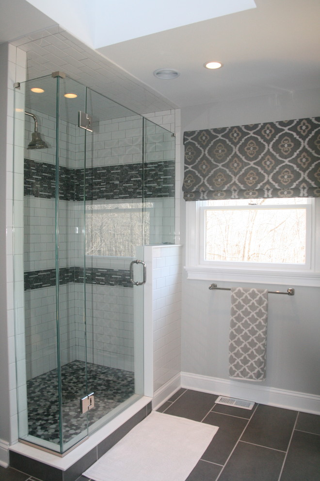 Inspiration for a mid-sized transitional master gray tile and mosaic tile porcelain tile corner shower remodel in New York with an undermount sink, shaker cabinets, white cabinets, quartz countertops, a one-piece toilet and gray walls