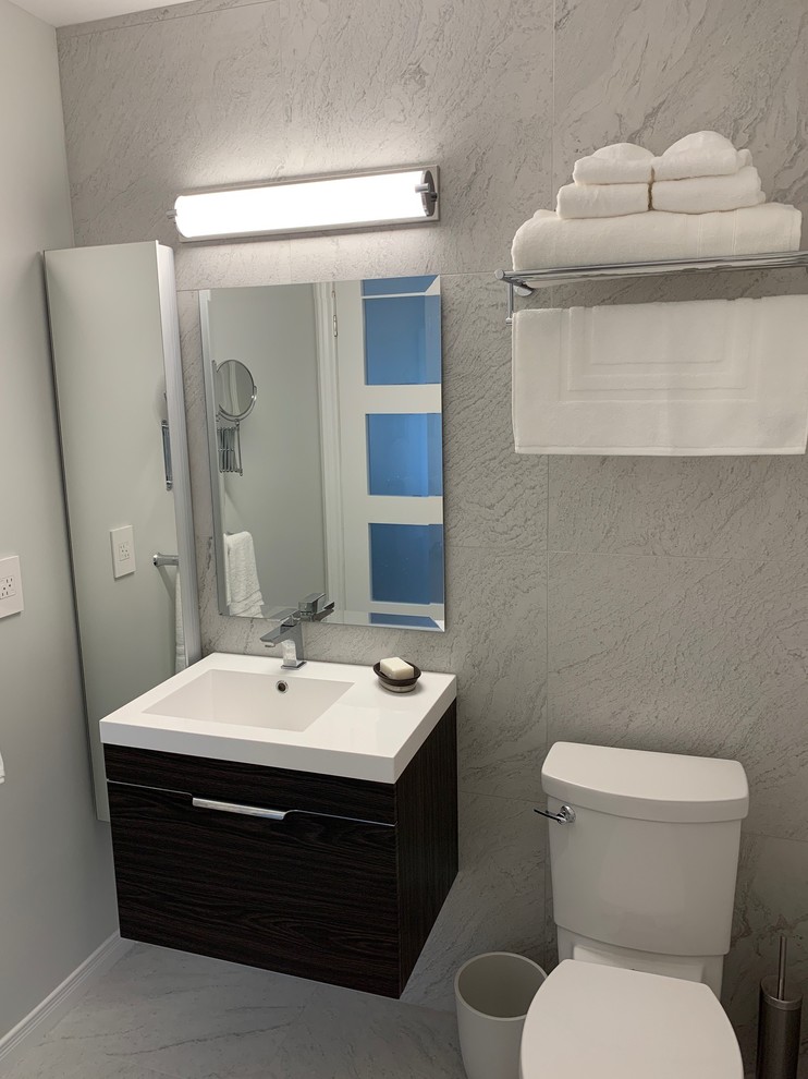Small modern shower room bathroom in Ottawa with flat-panel cabinets, dark wood cabinets, an alcove shower, grey tiles, stone tiles, an integrated sink, solid surface worktops, a shower curtain and white worktops.