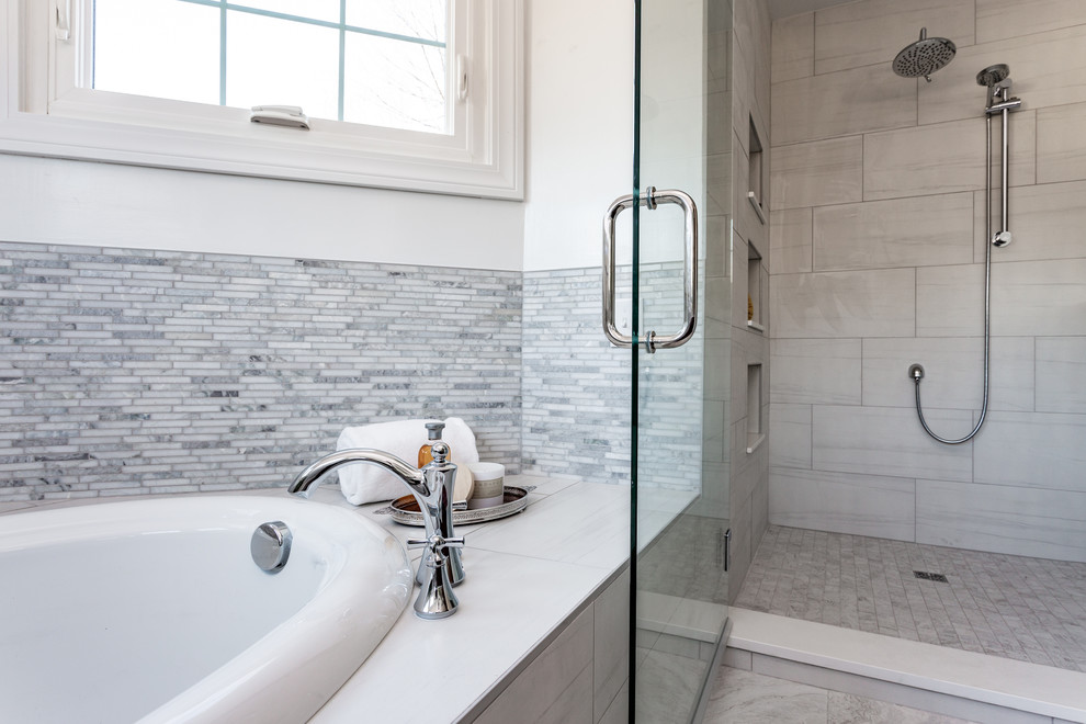 Example of a large transitional master gray tile and mosaic tile porcelain tile and gray floor bathroom design in Indianapolis with shaker cabinets, brown cabinets, a one-piece toilet, white walls, an undermount sink, quartz countertops, a hinged shower door and white countertops