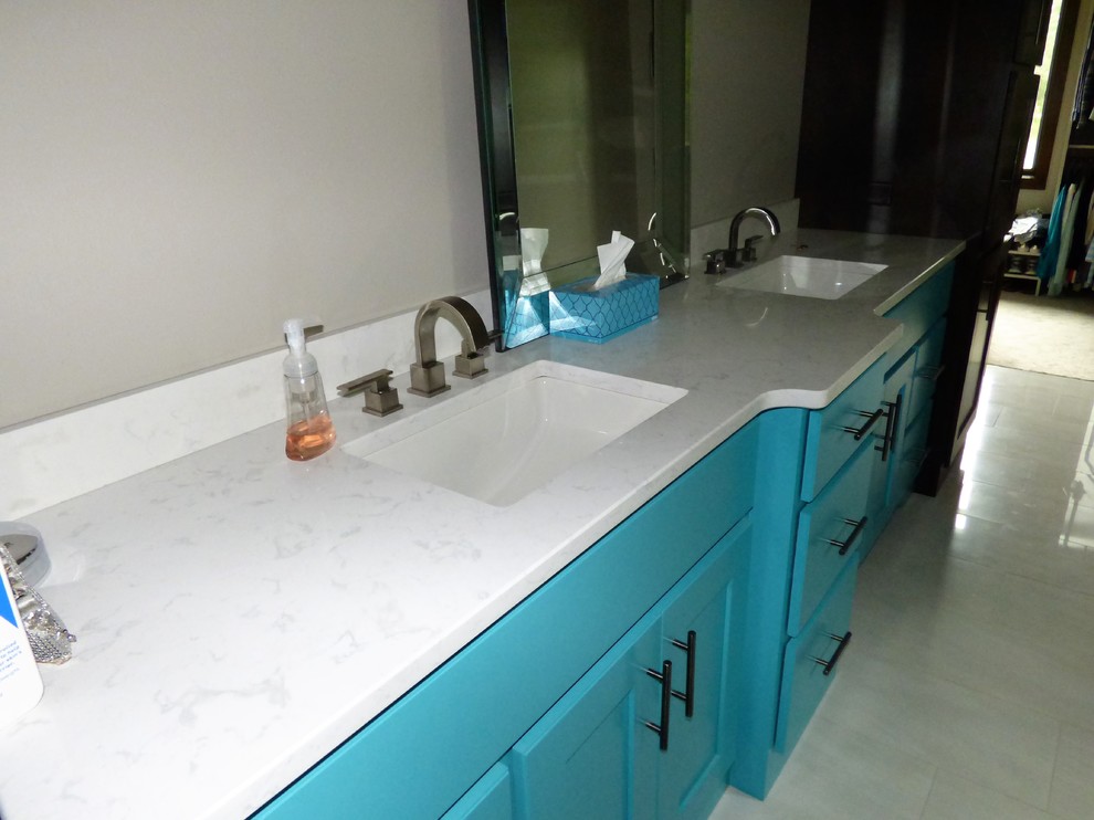 Bathroom - mid-sized transitional master ceramic tile and gray floor bathroom idea in Other with recessed-panel cabinets, turquoise cabinets, a two-piece toilet, gray walls, an undermount sink and quartz countertops