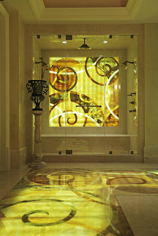 Ispirazione per una stanza da bagno padronale design con ante con riquadro incassato, ante marroni, top in marmo, vasca da incasso, doccia doppia, piastrelle multicolore e lastra di pietra