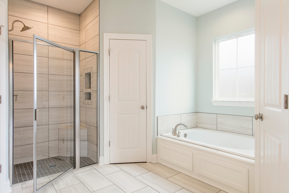 Inspiration for a mid-sized cottage master white tile and ceramic tile ceramic tile and beige floor bathroom remodel in New Orleans with flat-panel cabinets, white cabinets, a two-piece toilet, blue walls, a drop-in sink, granite countertops, a hinged shower door and white countertops