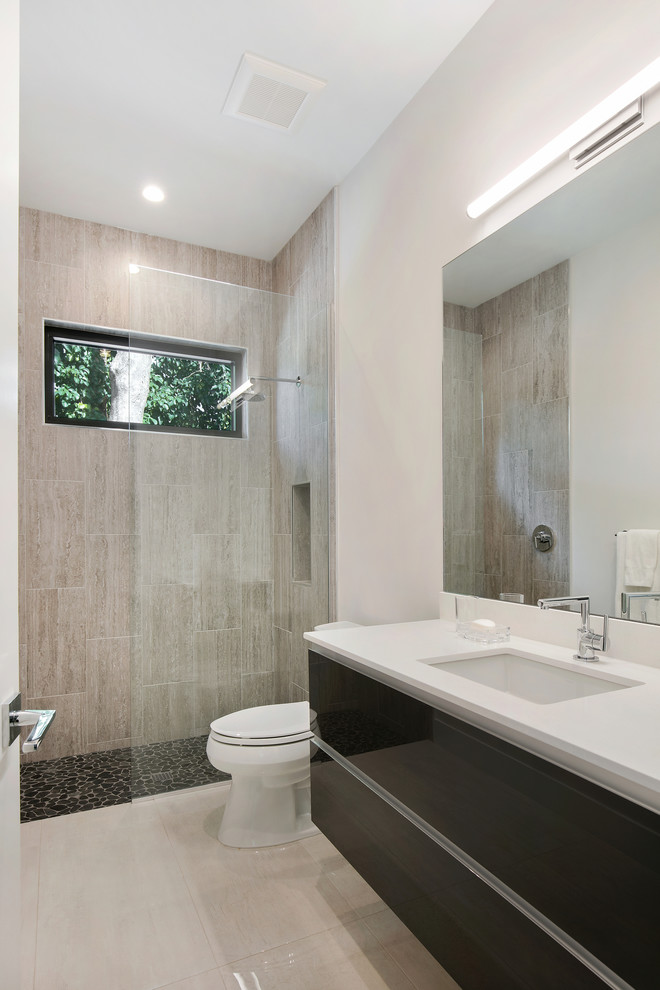 Design ideas for a medium sized modern family bathroom in Tampa with flat-panel cabinets, grey cabinets, a built-in shower, a two-piece toilet, grey tiles, porcelain tiles, white walls, porcelain flooring, a submerged sink, engineered stone worktops, white floors, an open shower and white worktops.