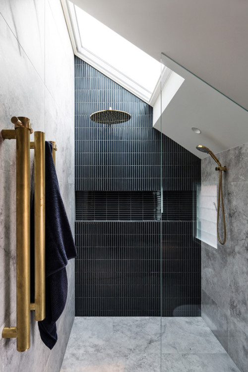 Industrial Elegance with Black Kit Kat Tiles and Antique Brass Accents