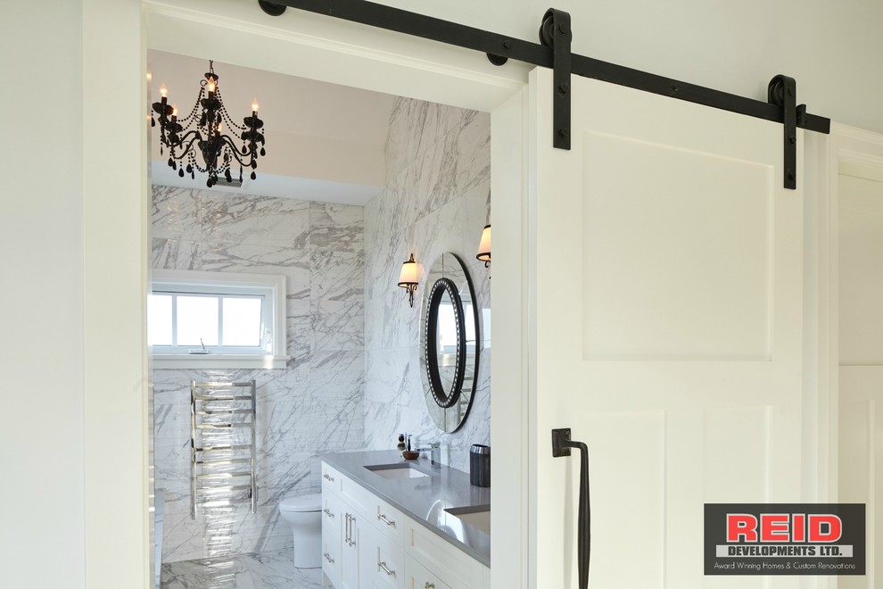 Inspiration for a mid-sized timeless master gray tile porcelain tile walk-in shower remodel in Vancouver with shaker cabinets, white cabinets, an undermount tub, a one-piece toilet, gray walls, an undermount sink and quartz countertops
