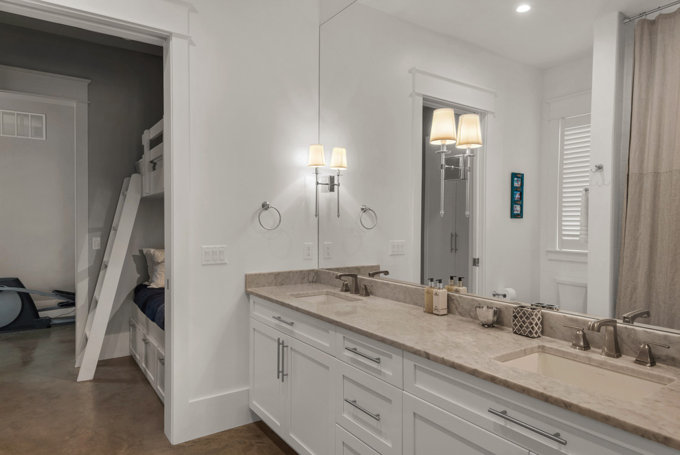 Идея дизайна: главная ванная комната среднего размера в стиле неоклассика (современная классика) с фасадами в стиле шейкер, белыми фасадами, угловым душем, белыми стенами, бетонным полом, врезной раковиной и столешницей из гранита