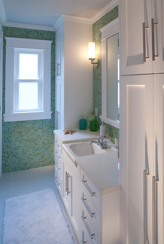 Photo of a medium sized classic family bathroom in San Diego with shaker cabinets, white cabinets, green tiles, glass tiles, porcelain flooring, a submerged sink and engineered stone worktops.