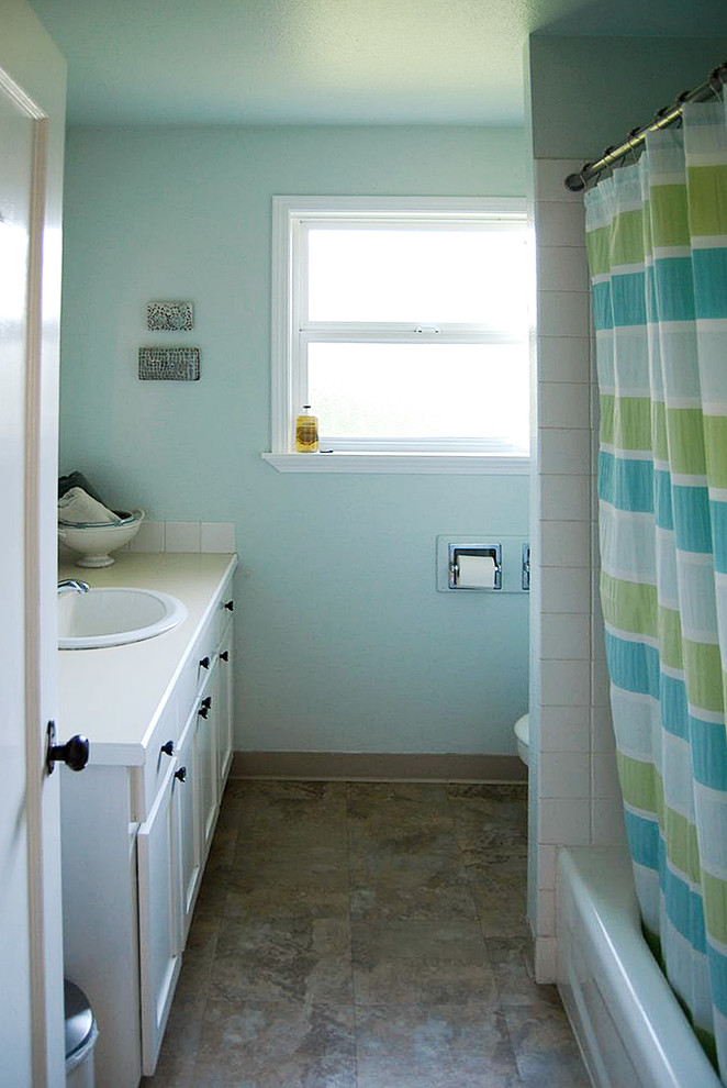 Small coastal bathroom in Portland with shaker cabinets, white cabinets, laminate worktops, white tiles, ceramic tiles, blue walls and lino flooring.