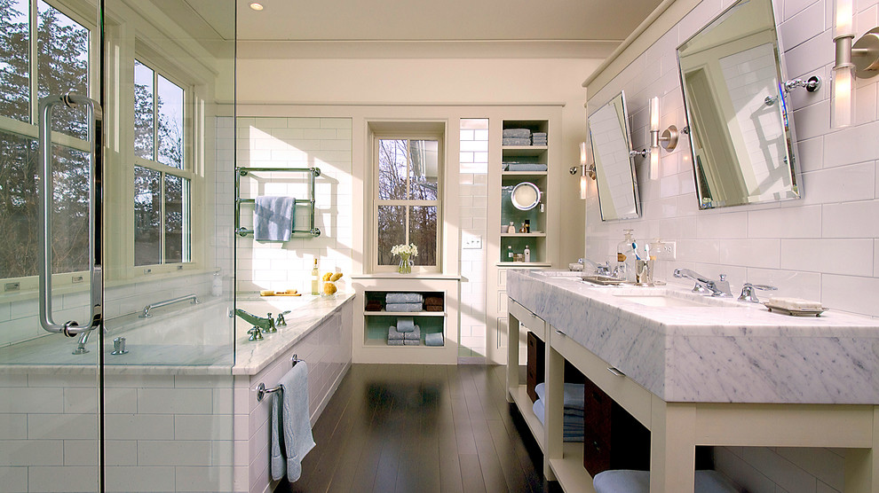 Inspiration for a large contemporary master white tile and glass tile dark wood floor corner shower remodel in Minneapolis with open cabinets, beige cabinets, an undermount tub, white walls, an undermount sink and marble countertops