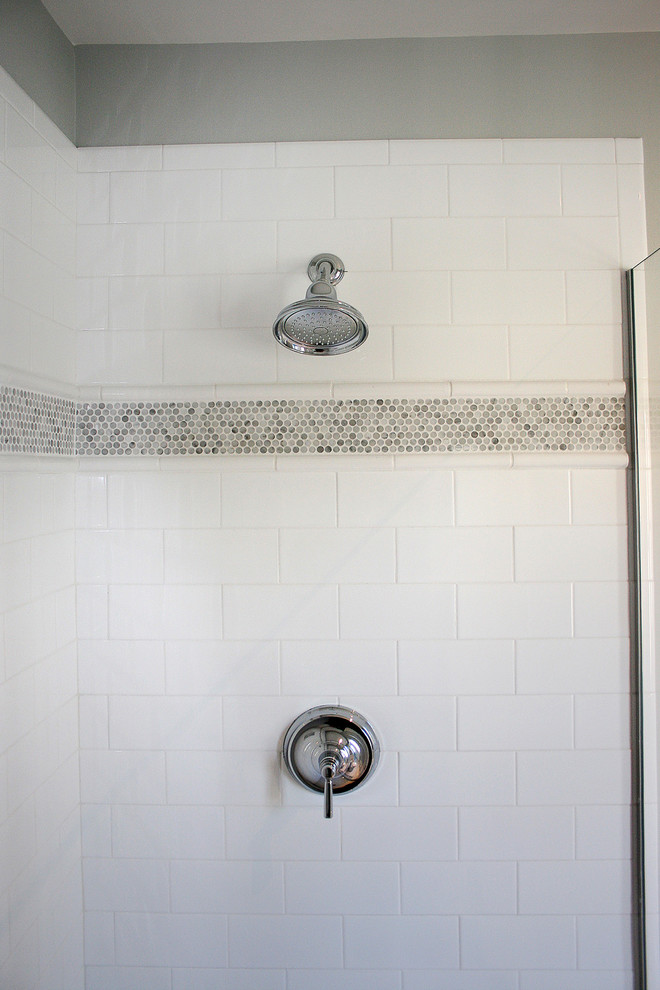 Inspiration for a coastal bathroom in Boston with white tiles, mosaic tiles and white walls.