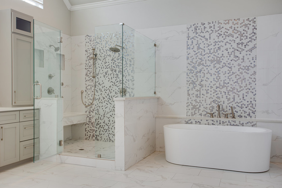 Inspiration for a large traditional ensuite bathroom in Dallas with shaker cabinets, grey cabinets, a freestanding bath, a corner shower, white tiles, porcelain tiles, porcelain flooring, engineered stone worktops, white floors, a hinged door and white worktops.