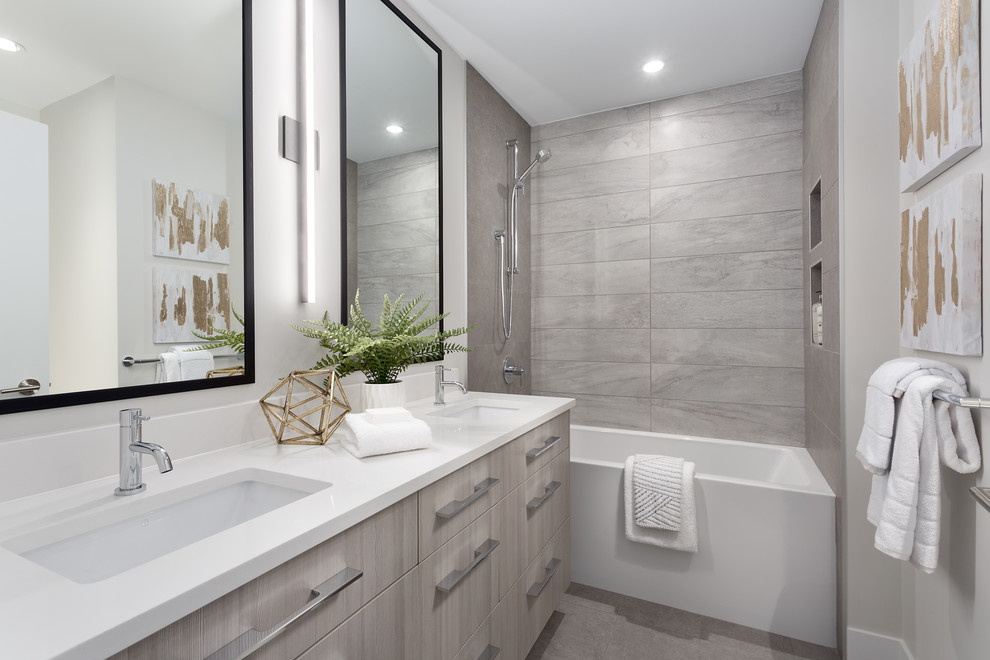 Bathroom - mid-sized contemporary 3/4 gray tile and porcelain tile gray floor and porcelain tile bathroom idea in Vancouver with flat-panel cabinets, an undermount sink, white countertops, light wood cabinets, beige walls and solid surface countertops