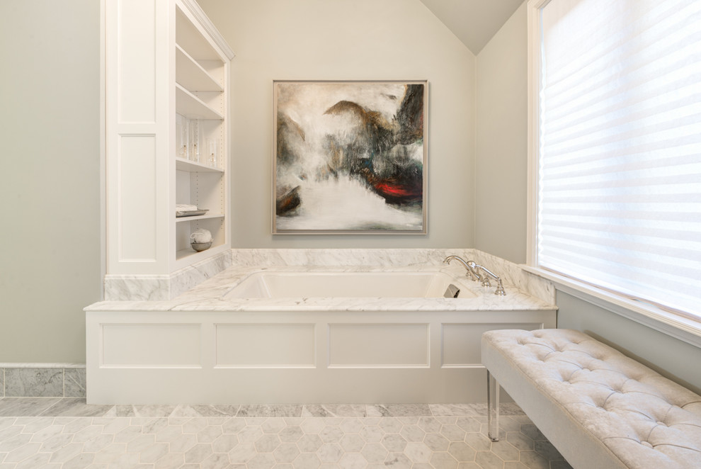 Inspiration for a large traditional ensuite bathroom in Seattle with recessed-panel cabinets, white cabinets, an alcove bath, an alcove shower, a two-piece toilet, white tiles, stone tiles, blue walls, marble flooring, a submerged sink and marble worktops.