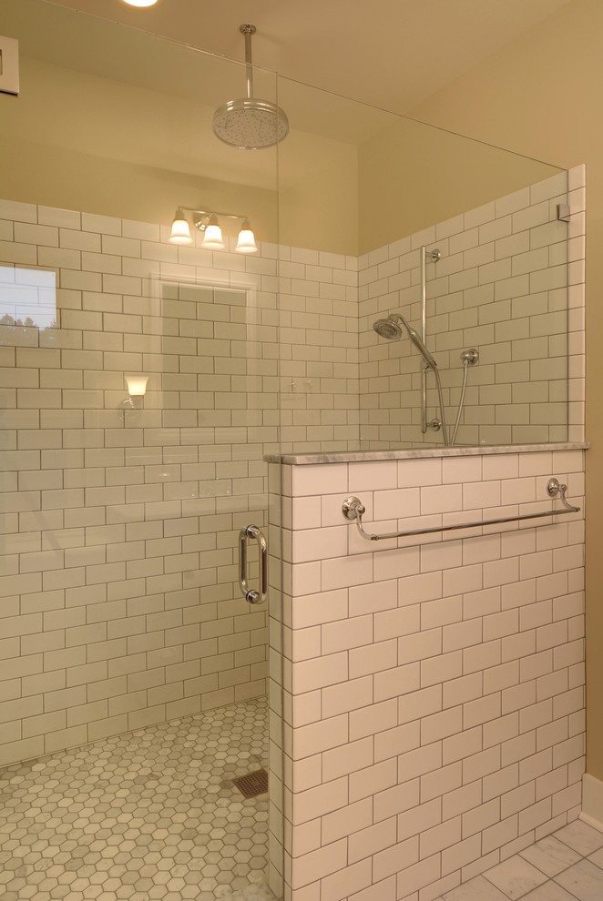 Classic bathroom in Seattle with a walk-in shower, metro tiles, beige walls and marble flooring.