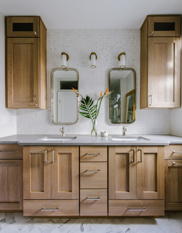 Inspiration for a mid-sized eclectic master white tile and marble tile marble floor and white floor corner shower remodel in Austin with shaker cabinets, light wood cabinets, a two-piece toilet, gray walls, an undermount sink, quartz countertops and a hinged shower door