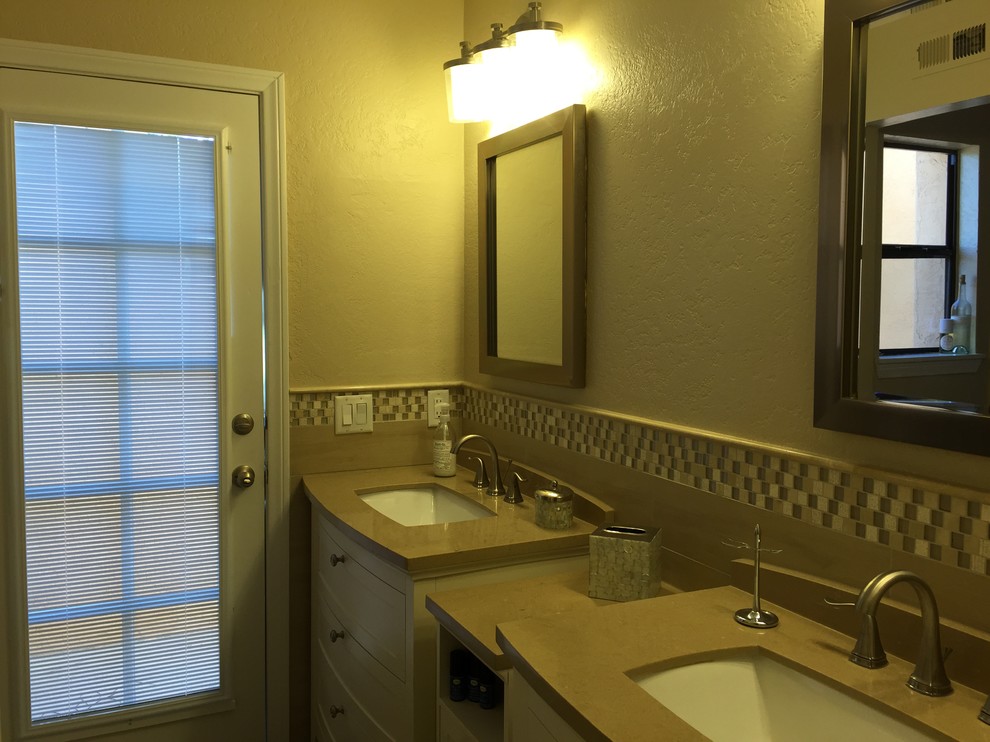 Example of a small trendy kids' beige tile and ceramic tile ceramic tile and gray floor bathroom design in San Diego with a drop-in sink, furniture-like cabinets, white cabinets, quartz countertops, an undermount tub, white walls and a two-piece toilet