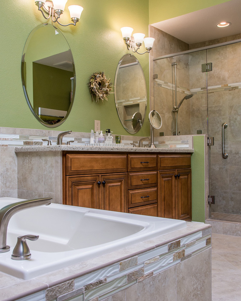 Design ideas for a medium sized coastal ensuite bathroom in San Diego with a built-in sink, recessed-panel cabinets, medium wood cabinets, granite worktops, a built-in bath, a corner shower, a one-piece toilet, beige tiles, stone slabs, green walls and terracotta flooring.