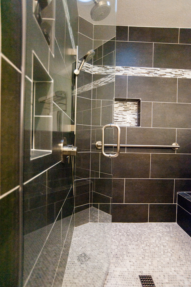 Example of a large trendy master black tile and ceramic tile porcelain tile alcove shower design in San Diego with flat-panel cabinets, dark wood cabinets, a two-piece toilet, white walls, a drop-in sink and quartzite countertops
