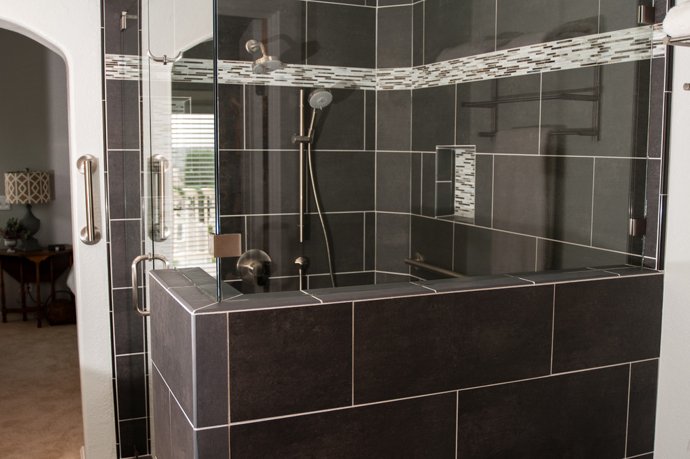 Photo of a large contemporary ensuite bathroom in San Diego with flat-panel cabinets, dark wood cabinets, an alcove shower, a two-piece toilet, black tiles, ceramic tiles, white walls, porcelain flooring, a built-in sink and quartz worktops.