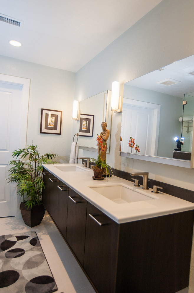 This is an example of a large contemporary ensuite bathroom in San Diego with flat-panel cabinets, dark wood cabinets, an alcove shower, a two-piece toilet, black tiles, ceramic tiles, white walls, porcelain flooring, a built-in sink and quartz worktops.