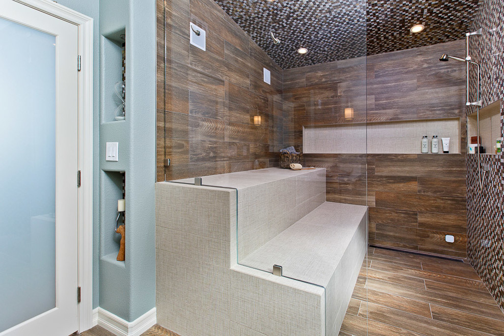 Large rustic sauna bathroom in Tampa with freestanding cabinets, distressed cabinets, mosaic tiles, engineered stone worktops, a one-piece toilet, multi-coloured walls, porcelain flooring, a submerged sink, an alcove shower and brown tiles.