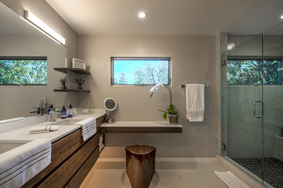 Medium sized midcentury ensuite bathroom in Other with flat-panel cabinets, dark wood cabinets, a corner shower, beige walls, ceramic flooring, a submerged sink and engineered stone worktops.
