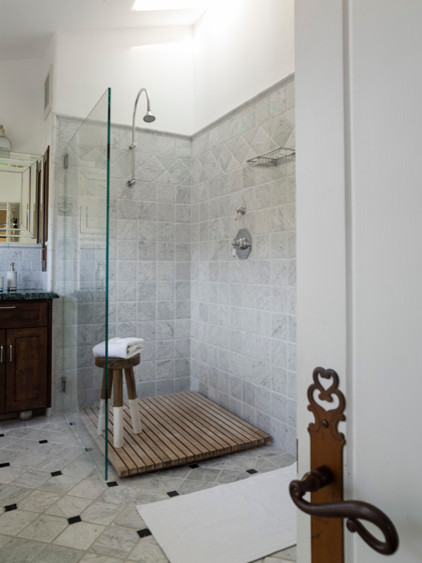 Doorless shower - small rustic master white tile and stone tile marble floor doorless shower idea in San Francisco with furniture-like cabinets, dark wood cabinets, marble countertops and white walls